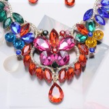 Accessories: necklace, earring set, colored gem