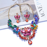 Accessories: necklace, earring set, colored gem