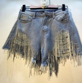 Perforated high waisted rhinestone tassel chain denim shorts