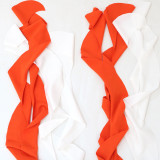 Diagonal shoulder top with wrap buttocks A-line tassel half skirt two-piece set