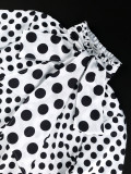 Long sleeved black and white polka dot top with collar