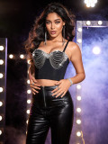 Wearing studded beads, rhinestones, tassels wrapped chest and slim fitting top outside the bra
