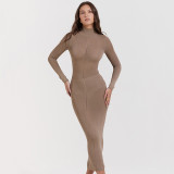 Knitted women's half high neck dress with a tight fitting and backless long skirt