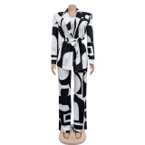 Two piece suit with printed straps long sleeved pants