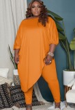 Conjunto de pantalones ajustados y camisa larga naranja irregular de talla grande de otoño