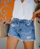 Pantalones cortos de mezclilla con borlas azules de verano