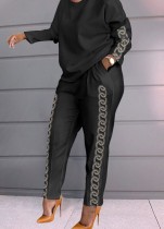 Camicetta allentata a maniche lunghe con scollo a 0 stampato nero casual da donna primaverile e pantaloni abbinati a due pezzi