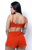 Großhandel Sportswear Sommer Orange Rüschen Weste und unregelmäßige Shorts Zweiteiliges Set