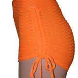 Pantaloncini da yoga solidi a vita alta a maniche corte arancioni da donna