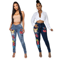 Röhrenjeans mit modischem Damen-Print