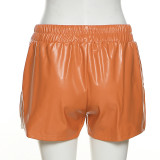 Pantalones cortos de cintura alta con cordones de cuero PU de color de contraste de moda para mujer