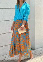Conjunto informal de falda pintada con top de manga larga y cuello en V a la moda para mujer de principios de otoño