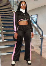 Conjunto deportivo de dos piezas con pantalones y camisa con bloques de colores y botones a rayas para mujer