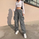 Pantalones de hip hop holgados con múltiples bolsillos de estilo callejero americano para mujer