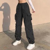 Pantalones de hip hop holgados con múltiples bolsillos de estilo callejero americano para mujer