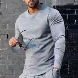 Camiseta básica de manga larga con cuello redondo y color liso para hombre
