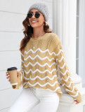 Women knitting long sleeve striped cutout sweater