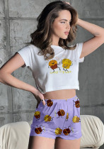 Conjunto de dos piezas de camiseta y pantalones cortos de manga corta con cuello redondo y estampado de verano para mujer
