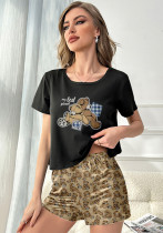 Conjunto de dos piezas de camiseta y pantalones cortos de manga corta con estampado de cuello redondo para mujer