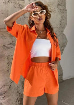 Fashion solid color short-sleeved shirt and shorts two piece set
