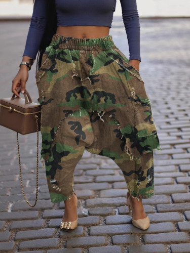 Trendy camouflage ripped harem pants for women, worn and loose, street style hanging crotch pants