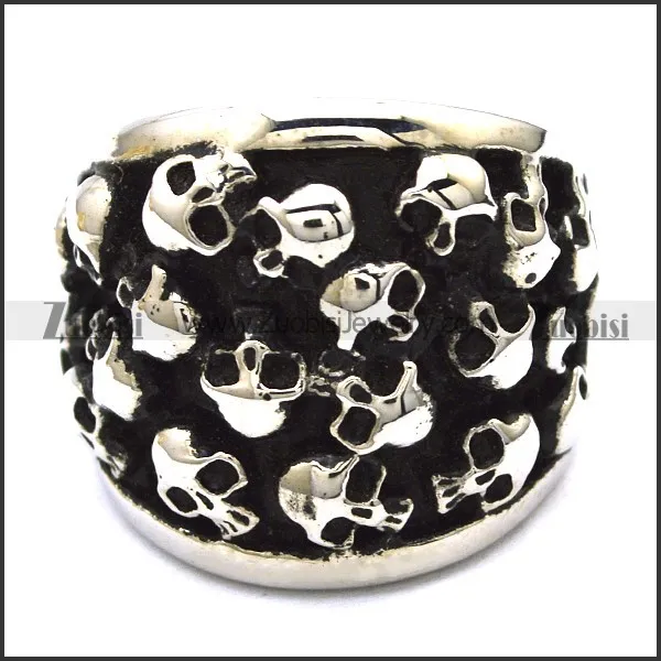 heavy ring with numerous small skull heads r001144