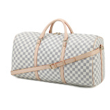 A stylish checkered duffel bag with beige leather straps, ideal for use as weekenders bags, a travel bag, or a gym bag.