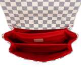 A stylish checkered crossbody bag with an adjustable shoulder strap and gold-tone hardware.